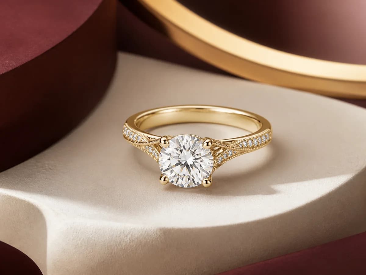 Illustrative two-carat engagement-ring direction in a refined jewelry still life