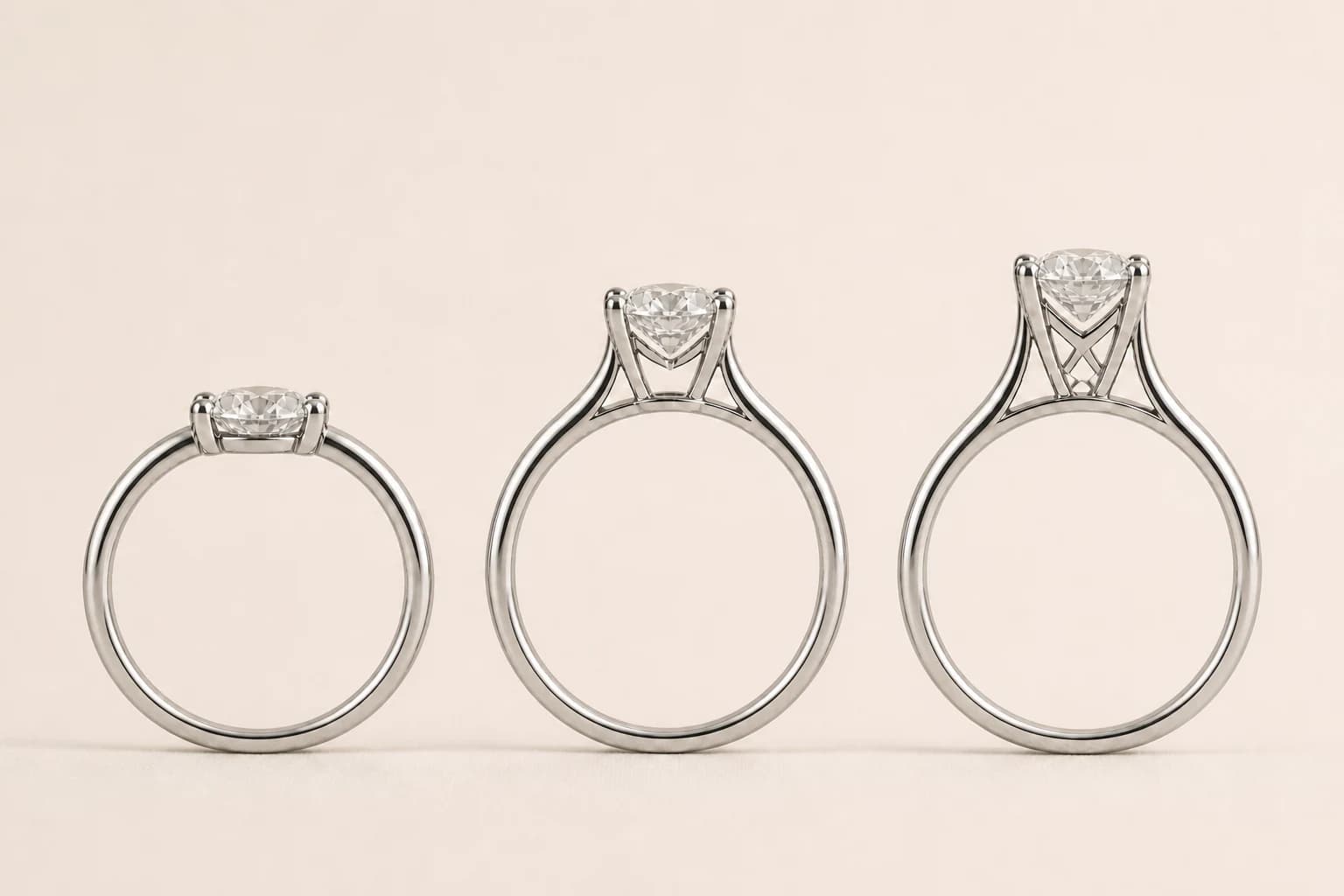 Three white-metal engagement ring side-profile concepts arranged from a low setting to a high setting