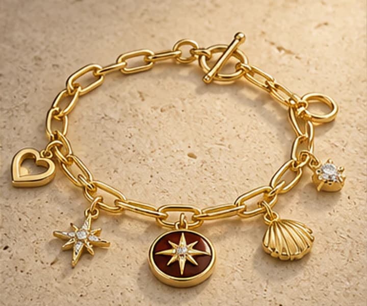 Illustrative gold charm bracelet with varied keepsake charms