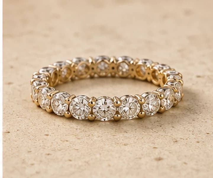 Illustrative diamond eternity band in warm gold