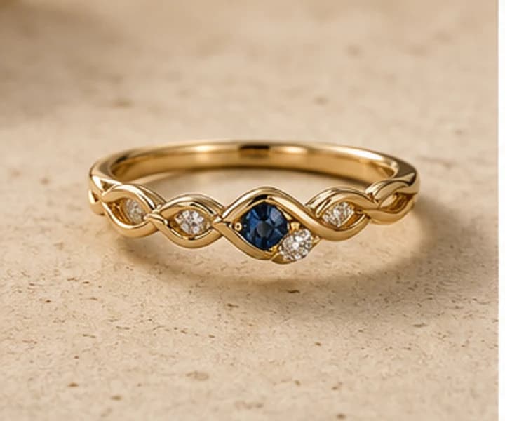 Illustrative delicate promise ring with blue center detail