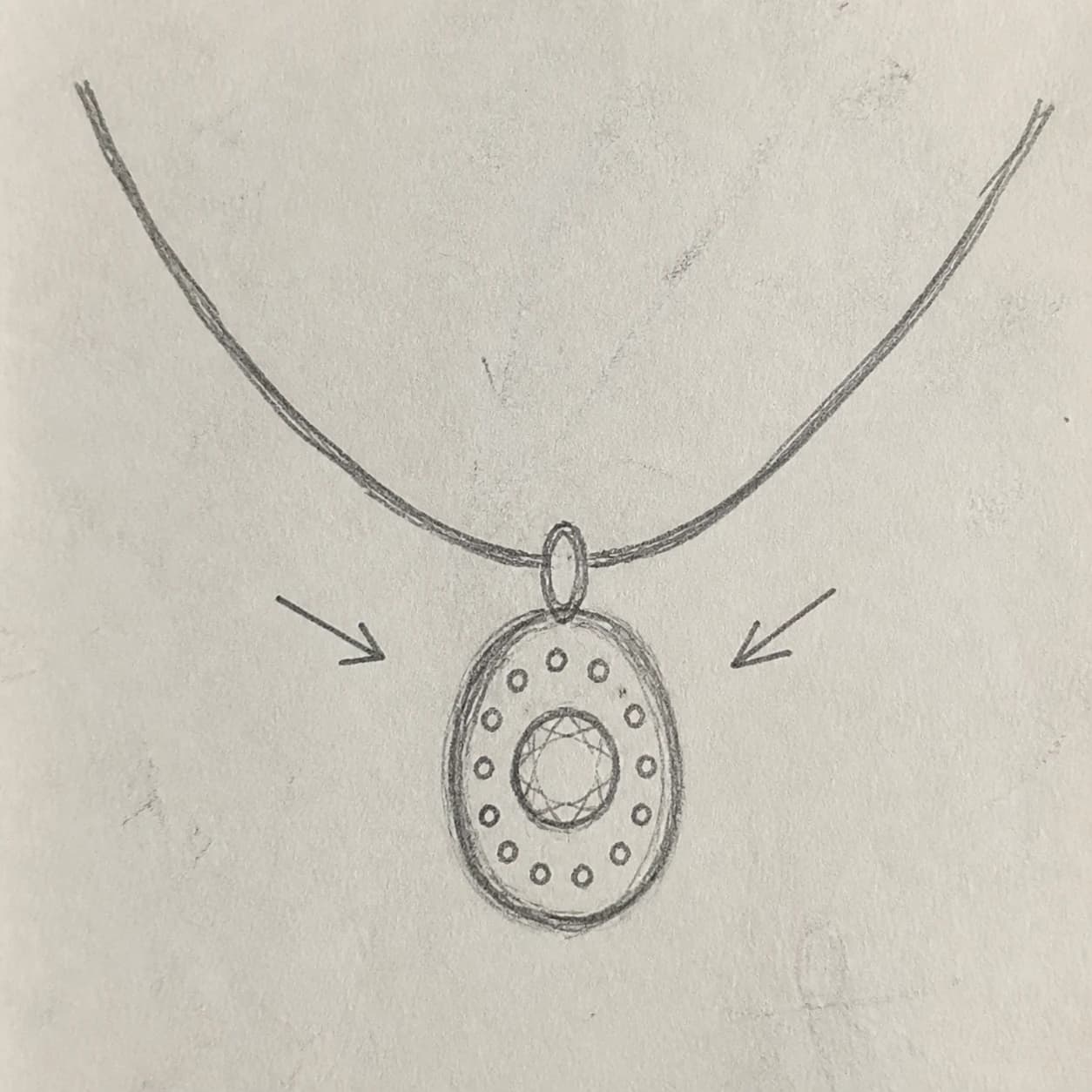 A customer sketch beside an elegant custom jewelry direction.