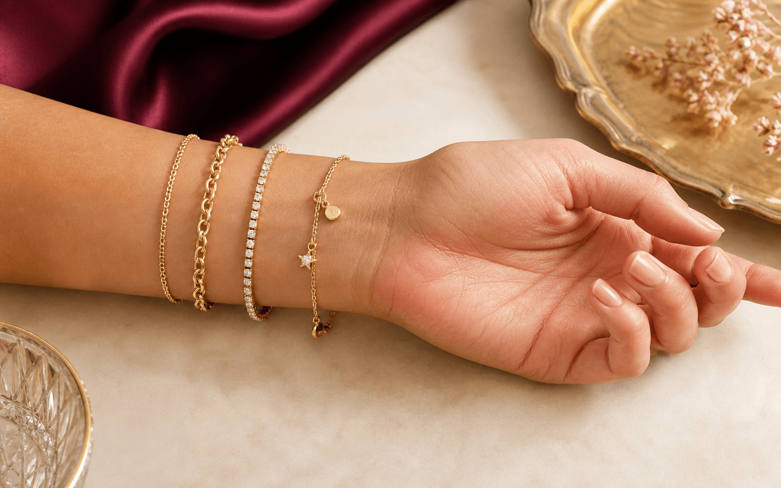 Illustrative adult wrist wearing several flexible bracelet constructions at their intended resting area