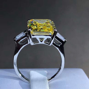 5 Carat Emerald Cut Moissanite Ring Vivid Yellow VVS Three Stone Basket