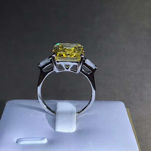 5 Carat Emerald Cut Moissanite Ring Vivid Yellow VVS Three Stone Basket