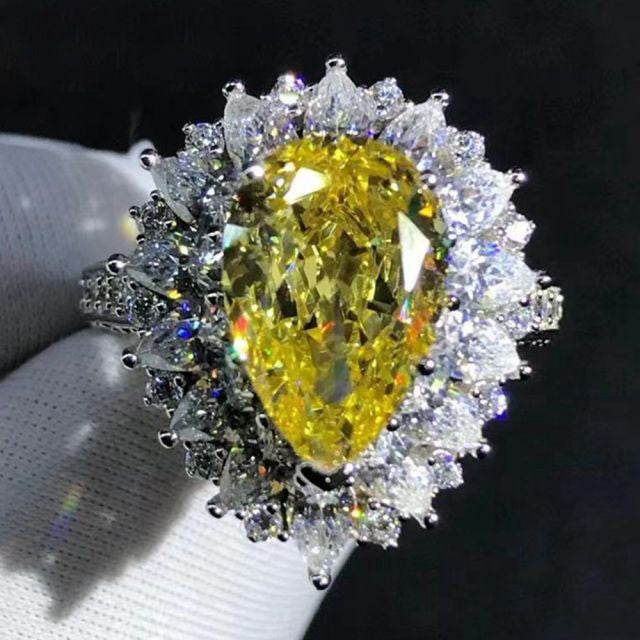 4 Carat Pear Cut Moissanite Ring Vivid Yellow VVS Halo Starburst