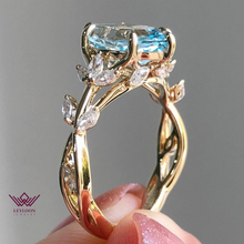 Load image into Gallery viewer, Marquise Cut Floral Infinity Shank VVS Lab Grown Aquamarine Ring