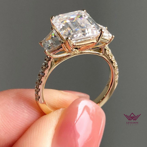 Emerald Cut Three-Stone French Pave D Color Basket Moissanite Ring