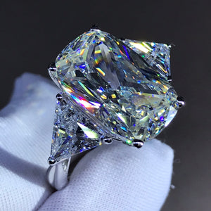 8 Carat K-M Colorless Elongated Cushion Cut Three Stone Reverse Tapered Simulated Sapphire Ring