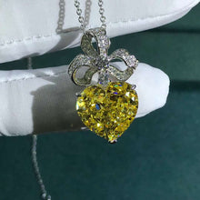 Load image into Gallery viewer, 15 Carat Yellow Heart Cut Bow Knot Halo VVS Simulated Sapphire Necklace