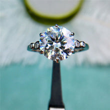 Load image into Gallery viewer, 4 Carat Round Cut Moissanite Ring 6 Prong 5 Stone Scalloped Shank VVS D Color